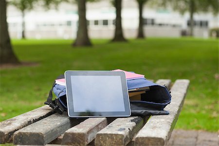 Purple schoolbag and tablet lying on park bench on campus at college Stock Photo - Budget Royalty-Free & Subscription, Code: 400-07141760