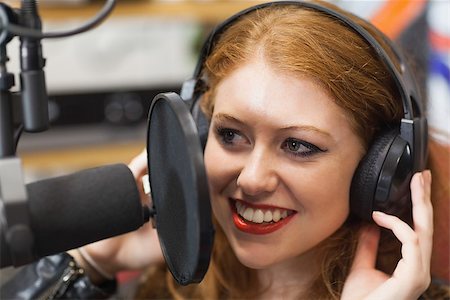 simsearch:400-05672202,k - Happy beautiful singer recording a song in studio at college Stock Photo - Budget Royalty-Free & Subscription, Code: 400-07141994