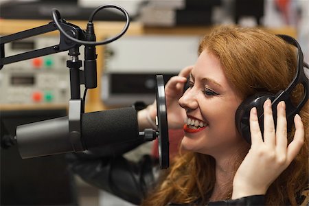 radio broadcasting - Cheerful beautiful singer recording a song in studio at college Stock Photo - Budget Royalty-Free & Subscription, Code: 400-07141990