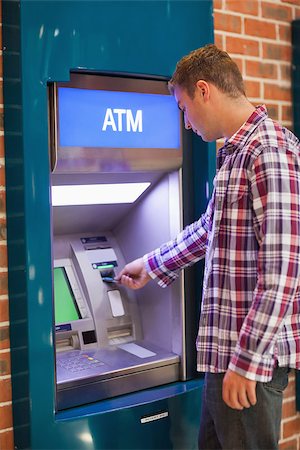 simsearch:400-07142149,k - Handsome student withdrawing cash at an ATM Stock Photo - Budget Royalty-Free & Subscription, Code: 400-07142138