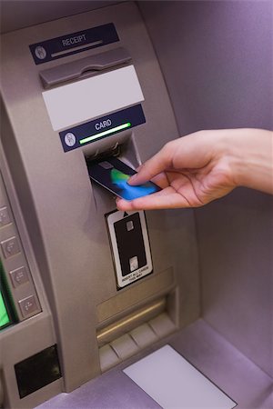 simsearch:400-07142149,k - Close up of hand pulling in debit card at an ATM Stock Photo - Budget Royalty-Free & Subscription, Code: 400-07142147