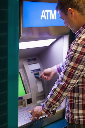 simsearch:400-07142149,k - Brunette student withdrawing cash at an ATM Stock Photo - Budget Royalty-Free & Subscription, Code: 400-07142140