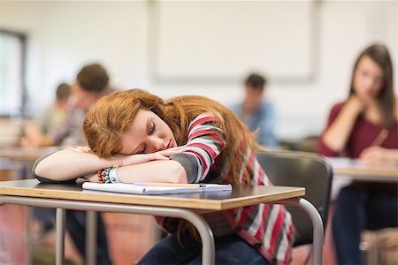 sleeping in a classroom - Blurred young college students sitting in the classroom with one asleep girl Foto de stock - Super Valor sin royalties y Suscripción, Código: 400-07142399