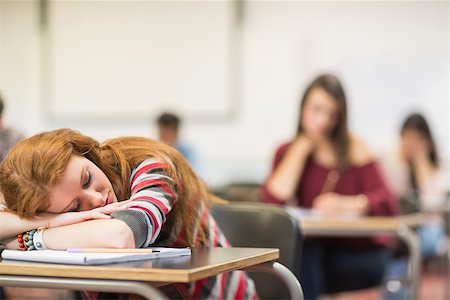 school class room sleeping girl - Blurred young college students sitting in the classroom with one asleep girl Stock Photo - Budget Royalty-Free & Subscription, Code: 400-07142400