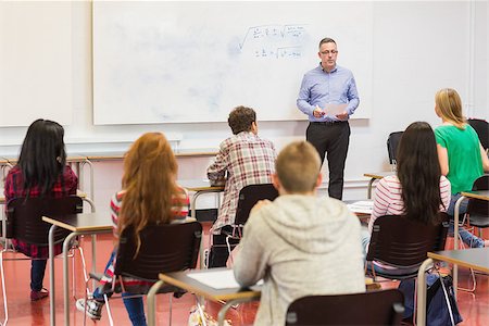 pictures of indian college classrooms in class room - Rear view of students attentively listening to male teacher in the classroom Stock Photo - Budget Royalty-Free & Subscription, Code: 400-07142472