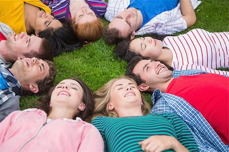 High angle view of a group of friends laying in a circle at park Stock Photo - Budget Royalty-Free & Subscription, Code: 400-07142577