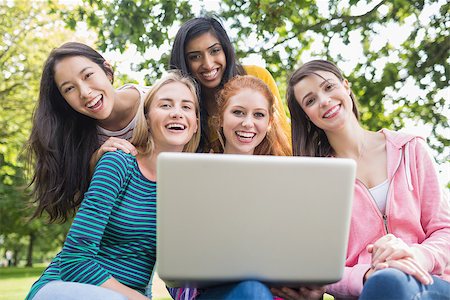 Group portrait of young college girls using laptop in the park Stock Photo - Budget Royalty-Free & Subscription, Code: 400-07142627