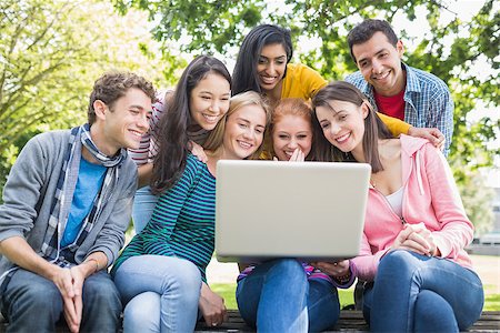 Group of young college students using laptop in the park Stock Photo - Budget Royalty-Free & Subscription, Code: 400-07142629