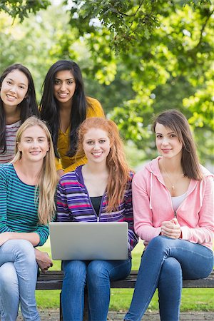 Group portrait of young college girls with laptop in the park Stock Photo - Budget Royalty-Free & Subscription, Code: 400-07142621