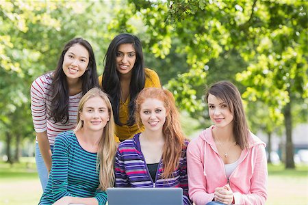 Group portrait of young college girls with laptop in the park Stock Photo - Budget Royalty-Free & Subscription, Code: 400-07142622