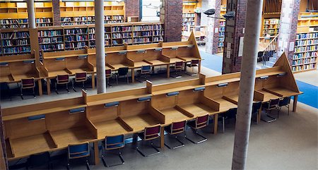 empty school chair - Empty seats with bookshelves in the background at college library Stock Photo - Budget Royalty-Free & Subscription, Code: 400-07143240