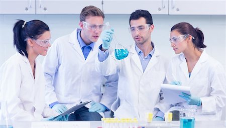 scientist tablet lab - Group of scientists with tablet PC working on an experiment at the laboratory Stock Photo - Budget Royalty-Free & Subscription, Code: 400-07143437
