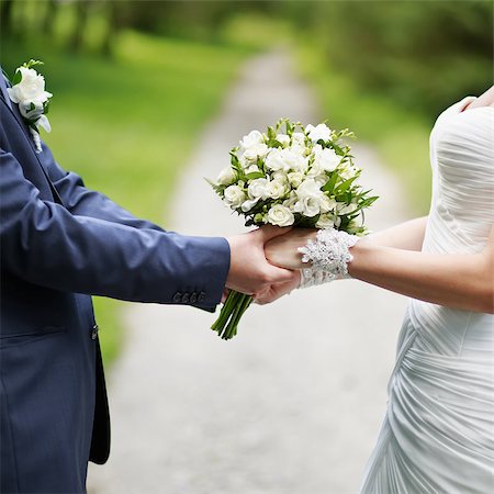 road of love and happiness, hands of a newly wed couple together Photographie de stock - Aubaine LD & Abonnement, Code: 400-07165230