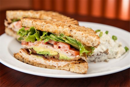 simsearch:400-07099478,k - A deli classic turkey bacon lettuce and tomato sandwich with avocado on whole wheat bread. Stock Photo - Budget Royalty-Free & Subscription, Code: 400-07165804