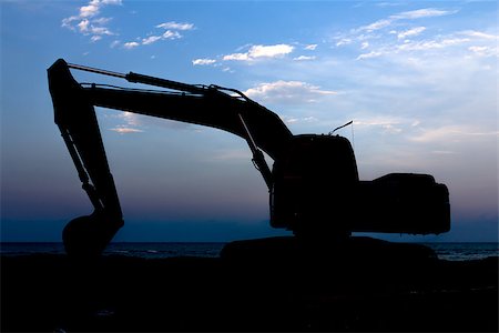 simsearch:400-04416966,k - Excavator standing in sandpit with raised bucket at seaside Foto de stock - Super Valor sin royalties y Suscripción, Código: 400-07166124