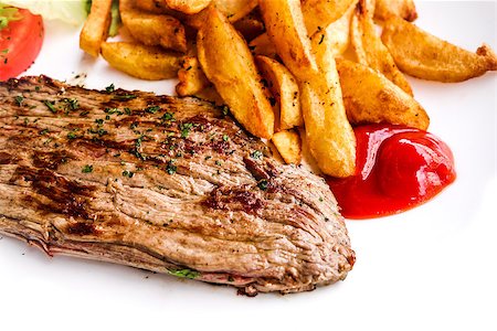 simsearch:400-05181259,k - juicy steak beef meat with tomato and french fries Foto de stock - Super Valor sin royalties y Suscripción, Código: 400-07166205