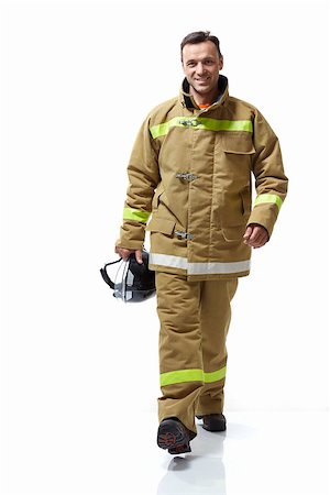 simsearch:400-07617056,k - Smiling firefighter in uniform on a white background Foto de stock - Super Valor sin royalties y Suscripción, Código: 400-07166348