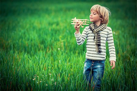 simsearch:400-08613554,k - Little boy with wooden plane Stock Photo - Budget Royalty-Free & Subscription, Code: 400-07166384
