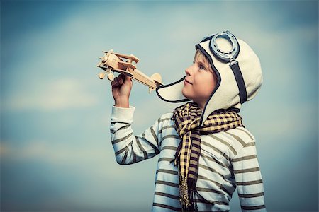 simsearch:400-08613554,k - Little boy with wooden plane Stock Photo - Budget Royalty-Free & Subscription, Code: 400-07166382