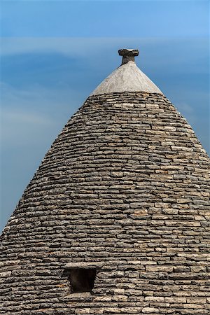 simsearch:862-06677053,k - Roof of the Trulli house. Typical historical house of Alberobello's town. Holiday destination in Apulia. Italy. Stock Photo - Budget Royalty-Free & Subscription, Code: 400-07166429