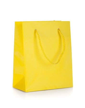 simsearch:400-04231102,k - Yellow gift bag. Isolated on white background Fotografie stock - Microstock e Abbonamento, Codice: 400-07166554
