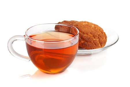simsearch:400-06554630,k - Glass cup of black tea with homemade cookies. Isolated on white background Stock Photo - Budget Royalty-Free & Subscription, Code: 400-07166628