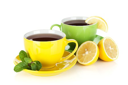 simsearch:400-04476908,k - Two colorful cups of tea with lemon and mint. Isolated on white background Stock Photo - Budget Royalty-Free & Subscription, Code: 400-07166634