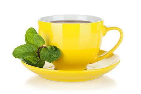 simsearch:400-04476908,k - Yellow tea cup with mint. Isolated on white background Stock Photo - Budget Royalty-Free & Subscription, Code: 400-07166633