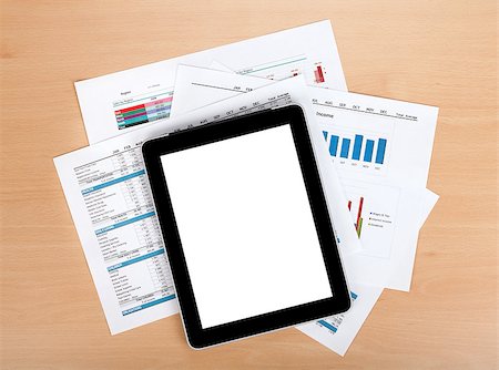 simsearch:400-08530598,k - Tablet with blank screen over papers with numbers and charts. View from above Stock Photo - Budget Royalty-Free & Subscription, Code: 400-07166750
