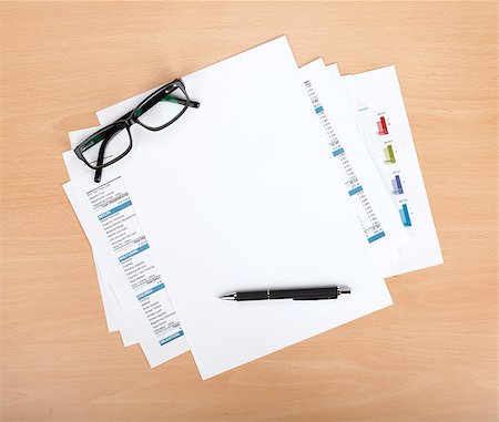 simsearch:400-07915276,k - Blank paper with pen and glasses over financial documents Photographie de stock - Aubaine LD & Abonnement, Code: 400-07166751