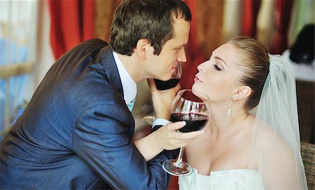 simsearch:400-07332647,k - glass of vine and happy groom and bride. Newlywed couple in cafe, lovely two Stockbilder - Microstock & Abonnement, Bildnummer: 400-07166815