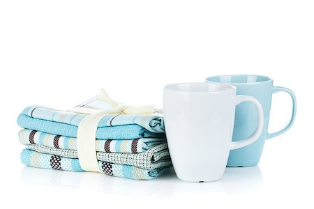 simsearch:400-04799995,k - Kitchen towels and tea cups. Isolated on white background Stock Photo - Budget Royalty-Free & Subscription, Code: 400-07167111