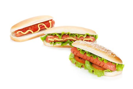 simsearch:400-07167126,k - Three hot dogs with various ingredients. Isolated on white background Stockbilder - Microstock & Abonnement, Bildnummer: 400-07167129