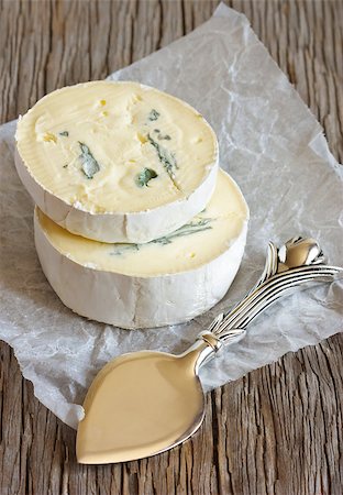 soft cheese cream - Delicious soft cheese and knife on a wooden background. Stock Photo - Budget Royalty-Free & Subscription, Code: 400-07167299
