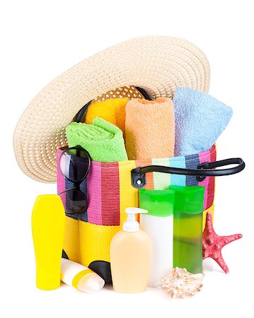 simsearch:400-07167440,k - Bag with towels, sunglasses, hat and beach items. Isolated on white background Foto de stock - Super Valor sin royalties y Suscripción, Código: 400-07167434