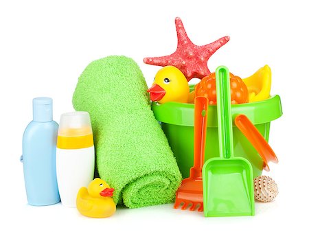 Beach baby toys, towels and bottles. Isolated on white background Stock Photo - Budget Royalty-Free & Subscription, Code: 400-07167556