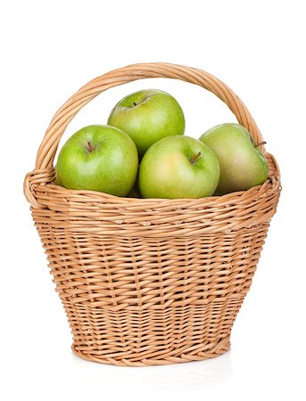 simsearch:400-07823938,k - Fresh ripe green apples in basket. Isolated on white background Photographie de stock - Aubaine LD & Abonnement, Code: 400-07167593