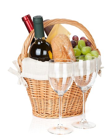 Picnic basket with bread, cheese, grape, wine bottles and two glasses. Isolated on white background Stock Photo - Budget Royalty-Free & Subscription, Code: 400-07167609