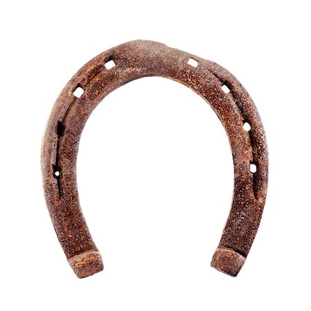 ferradura - Old rusty and worn horseshoe isolated on white. Foto de stock - Royalty-Free Super Valor e Assinatura, Número: 400-07167949