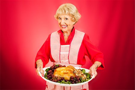 serving meals to the elderly - Sweet grandmother holding a beautifully cooked turkey dinner. Stock Photo - Budget Royalty-Free & Subscription, Code: 400-07168211