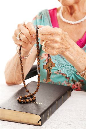 Closeup of senior woman's hands as she says the rosary. Stock Photo - Budget Royalty-Free & Subscription, Code: 400-07168212