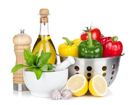 Fresh ripe vegetables in colander, herbs and condiments. Isolated on white background Stock Photo - Budget Royalty-Free & Subscription, Code: 400-07168543