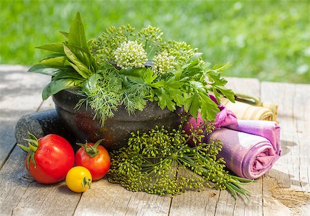 simsearch:400-04846756,k - Fresh herbs in mortar on wood table Stock Photo - Budget Royalty-Free & Subscription, Code: 400-07168625