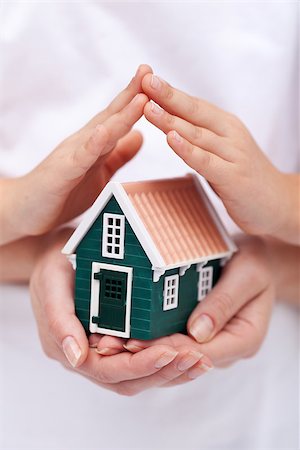 roof and hands - Security, insurance and safety concept with house protected by hands Stock Photo - Budget Royalty-Free & Subscription, Code: 400-07168822