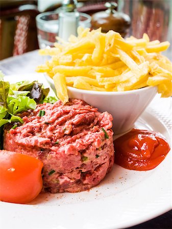 simsearch:400-07713408,k - tasty Steak tartare (Raw beef) - classic steak tartare on white plate Stock Photo - Budget Royalty-Free & Subscription, Code: 400-07168879