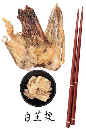 simsearch:400-07169572,k - Angelica herb root used in traditional chinese herbal medicine with mandarin title script translation and chopsticks. Dang gui. Foto de stock - Super Valor sin royalties y Suscripción, Código: 400-07169408