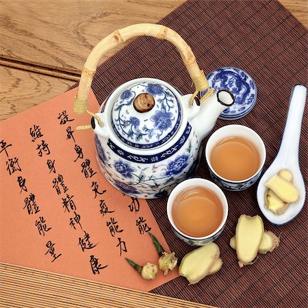 simsearch:400-07169572,k - Ginger tea used in chinese herbal medicine with mandarin calligraphy on rice paper and teapot. Sheng jiang Translation describes the medicinal functions to increase the bodys ability to maintain body and spirit health and balance energy. Foto de stock - Super Valor sin royalties y Suscripción, Código: 400-07169411