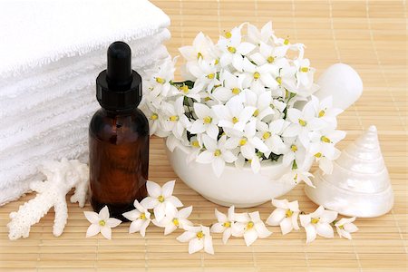 simsearch:400-07175956,k - Aromatherapy natural health treatment with jasmine flowers, essential oil bottle and bathroom accessories. Stock Photo - Budget Royalty-Free & Subscription, Code: 400-07169420