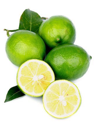 simsearch:400-05265200,k - Heap of Fresh Ripe Green Lemons with Halves and Leafs isolated on white background Photographie de stock - Aubaine LD & Abonnement, Code: 400-07169439