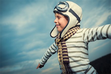 pilots with scarves - Smiling boy on the background of sky Stock Photo - Budget Royalty-Free & Subscription, Code: 400-07169516